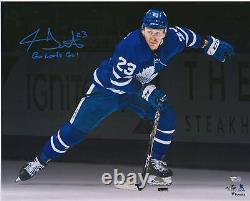 Travis Dermott Maple Leafs Signed 16x20 Blue Jersey Skating Photo & Insc 23/23